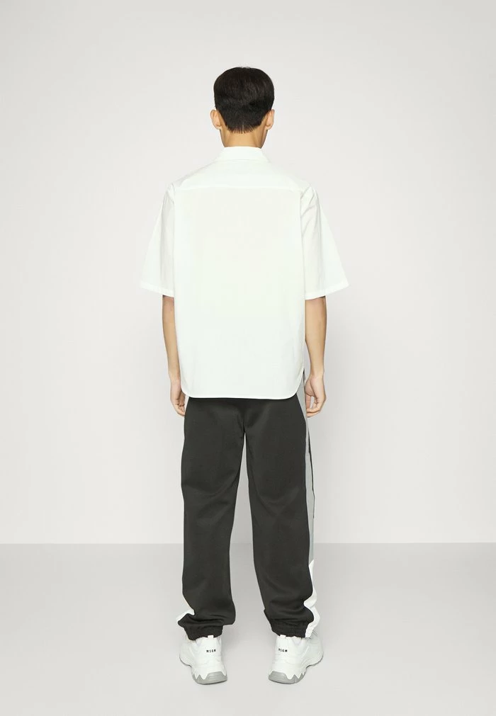 TRIBECA TRACK PANTS - Tracksuit bottoms - black mix Holzweiler TRIBECA TRACK PANTS - Tracksuit Bottoms - Black Mix -Holzweiler shop 2f31aceb6c8c48aa93aa821016ed9280