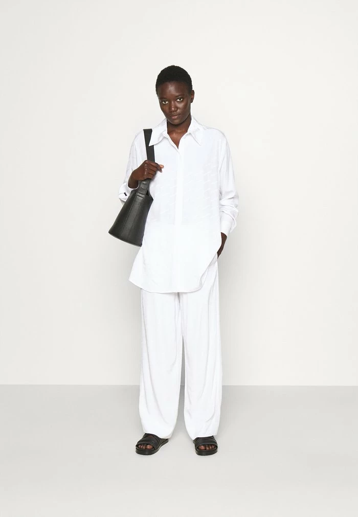 NUKA TROUSER - Trousers - white Holzweiler NUKA TROUSER - Trousers - White -Holzweiler shop 509fa4e95e1643d3a89d4ffe076a51ac