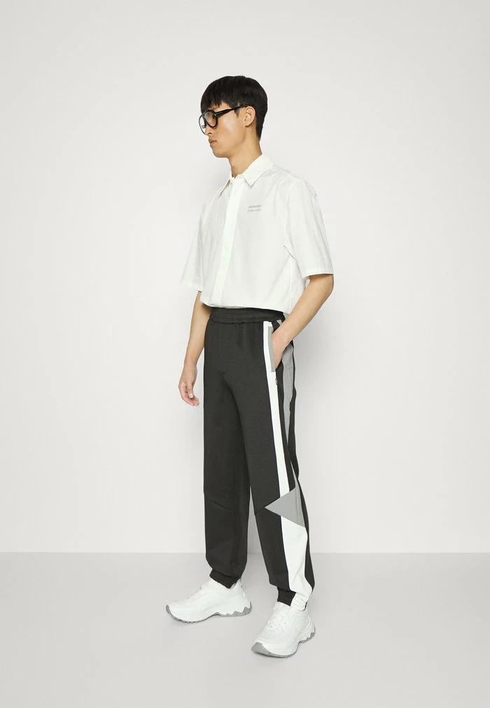 TRIBECA TRACK PANTS - Tracksuit bottoms - black mix Holzweiler TRIBECA TRACK PANTS - Tracksuit Bottoms - Black Mix -Holzweiler shop b9f25626440444ebb4fc35dee017b1d9