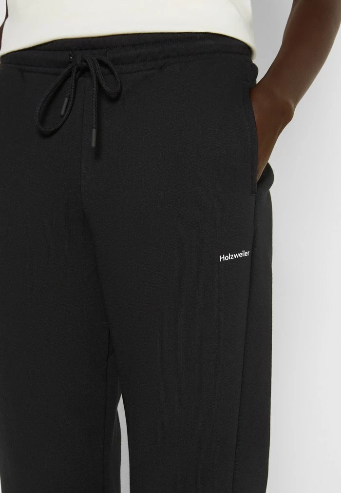 GABBY TROUSER - Tracksuit bottoms - black Holzweiler GABBY TROUSER - Tracksuit Bottoms - Black -Holzweiler shop dd7ce99af4154be4a60355152e46aaa0